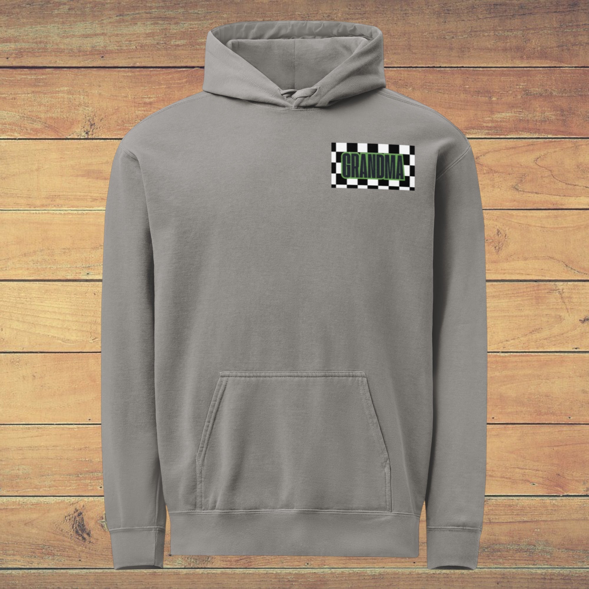 LilLlamaBean grey garment-dyed cotton blend hoodie with 'GRANDMA' in green text on a checkered flag patch.