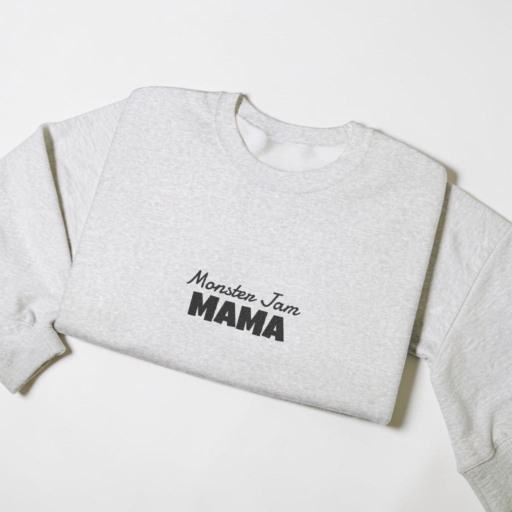 LilLlamaBean light heather grey crewneck sweatshirt with embroidered "Monster Jam MAMA" text in black.